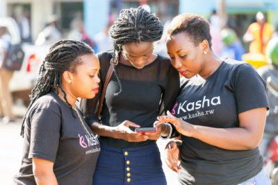 Women discussing something and wearing Kasha T-shirts
