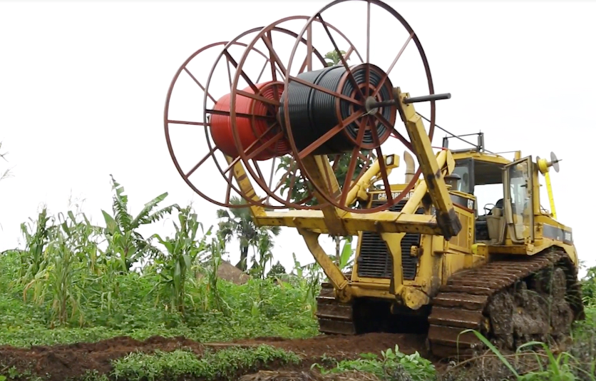 A tractor carrying telecommunication cable 