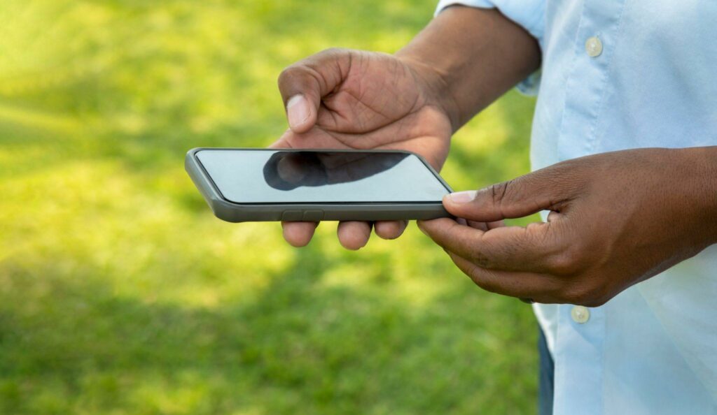 Hands holding a mobile phone