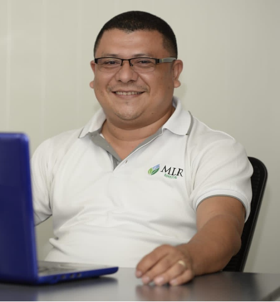 A person sitting behind a laptop