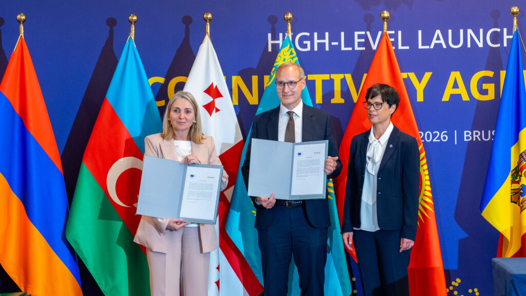 Adrienn Kiraly, Lauri Hirvonen and Marta Kos at the signing ceremony holding the signed agreement